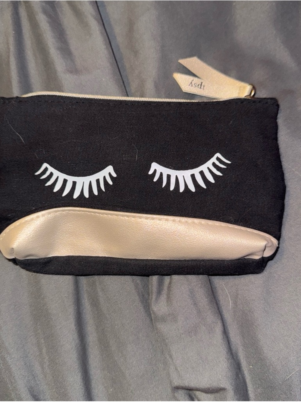 ipsy Black Cosmetic Pouch with White Eyelash Print and Gold Trim